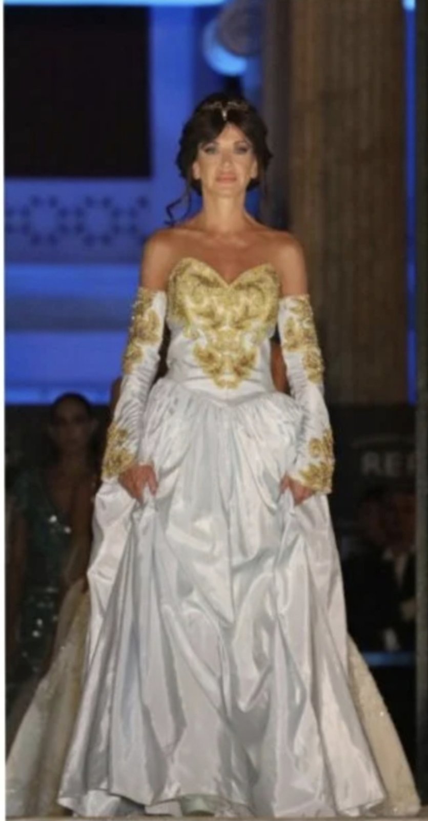 Gold embroidered ballgown on the runway