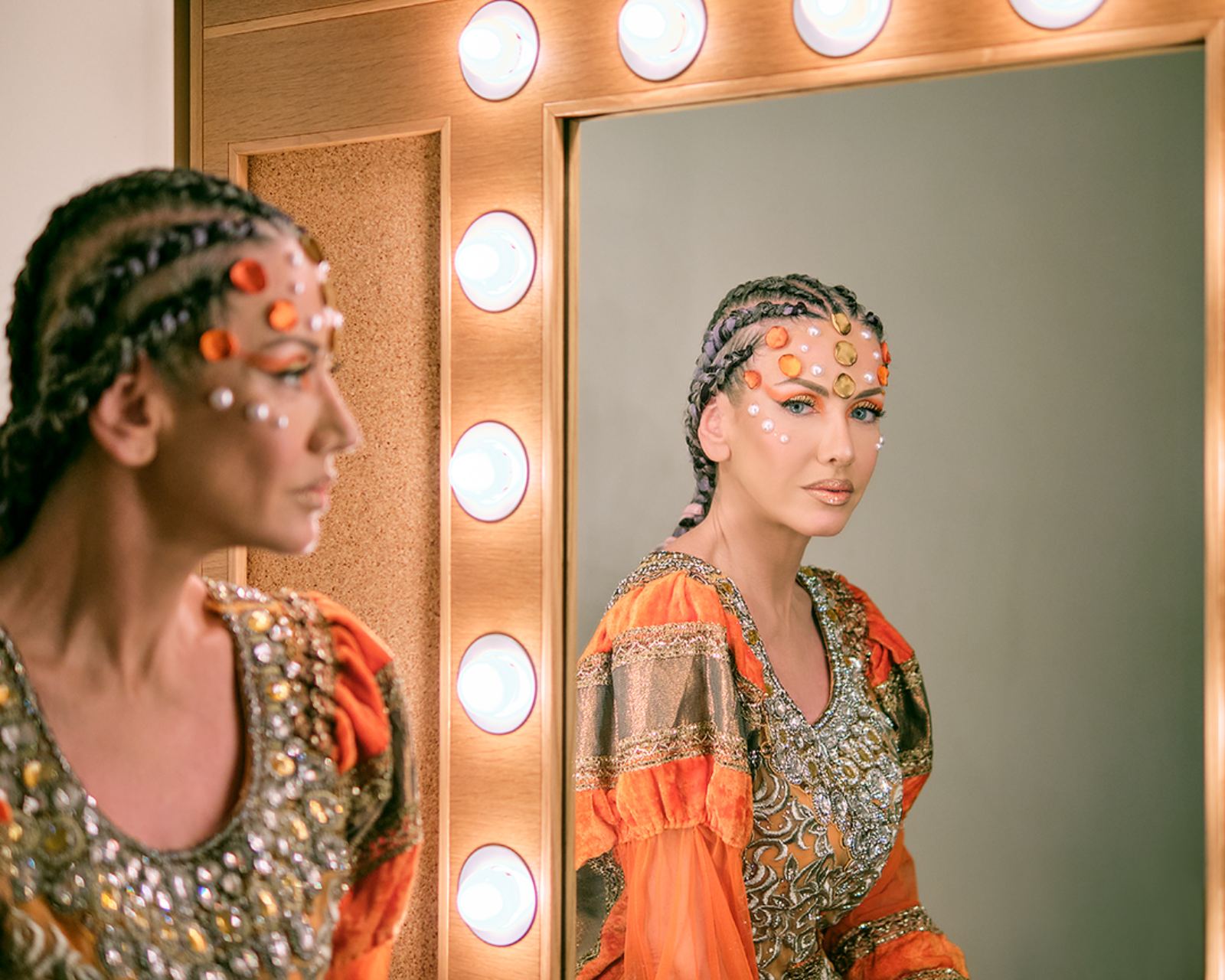 Jewelled braids reflected in the dressing-room mirror