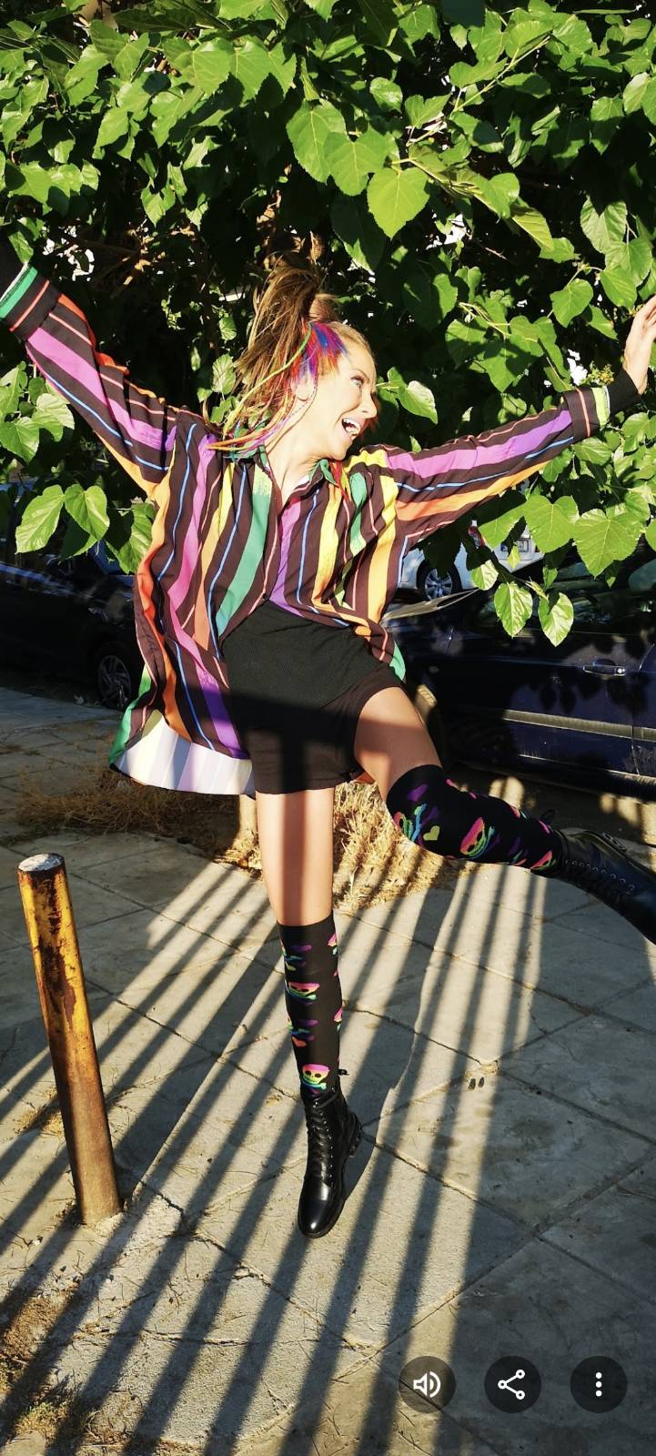 Rainbow striped shirt with patterned socks and boots