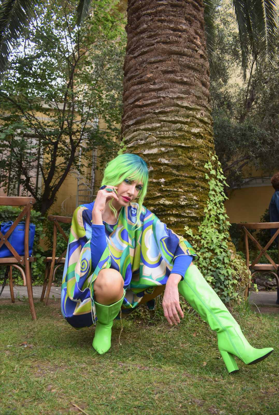 Psychedelic print kaftan with neon green thigh boots