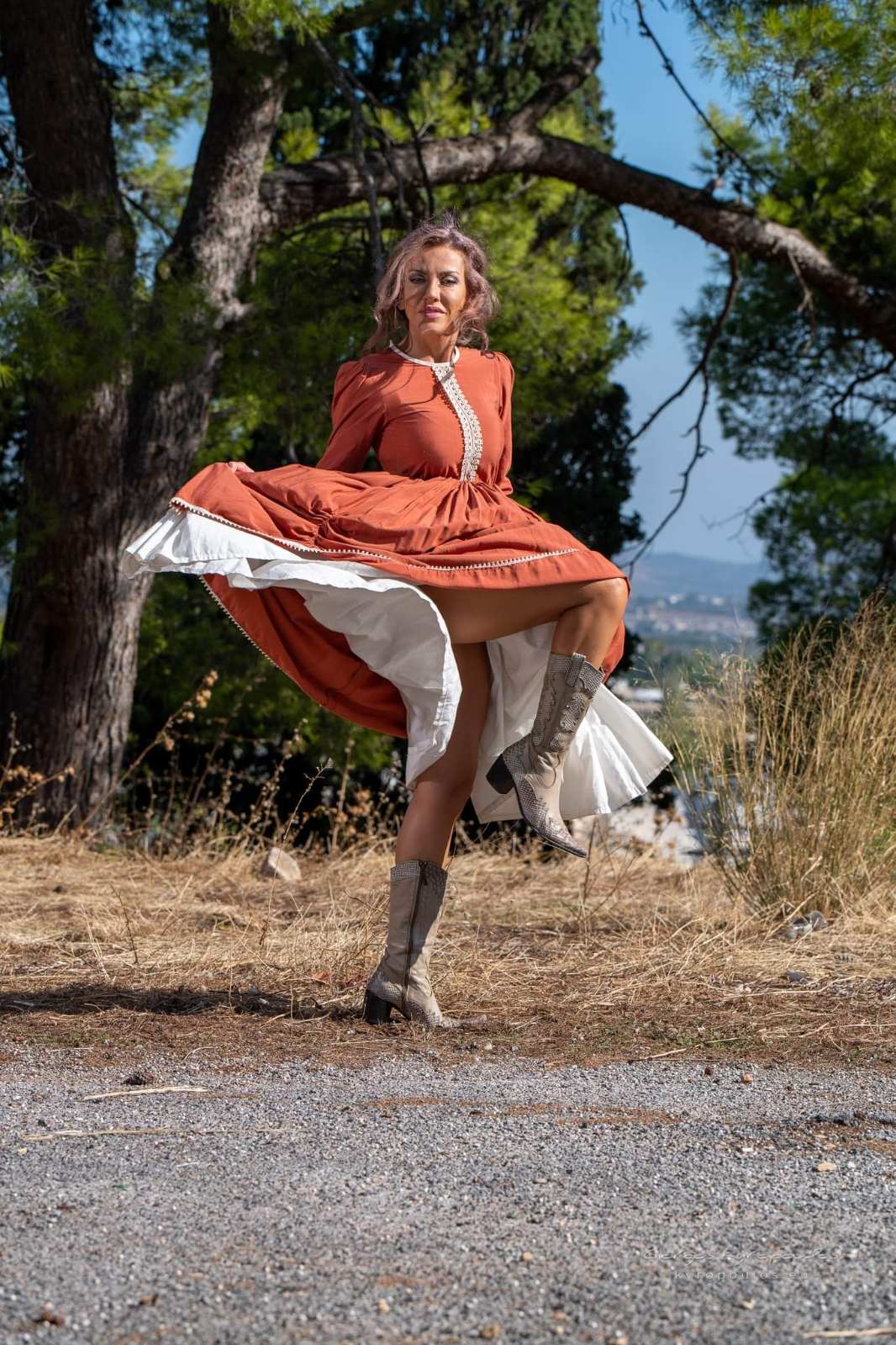 Terracotta prairie dress with snakeskin cowboy boots